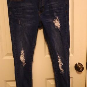 Ripped dark blue jeans